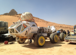 Aerial Filming The Martian in Wadi Rum, Jordan showing  Mars Rover | Marzano Films